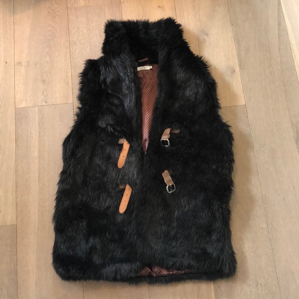 Oversized black fur vest